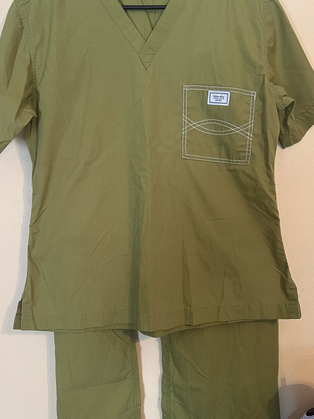 Blue Sky Olive Green V-Neck Scrub Top with Stitch-Detail Chest Pocket